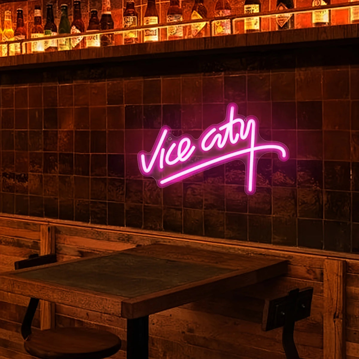 Neon sign reading 'Vice City' in a bar setting with wooden tables and tiled wall.