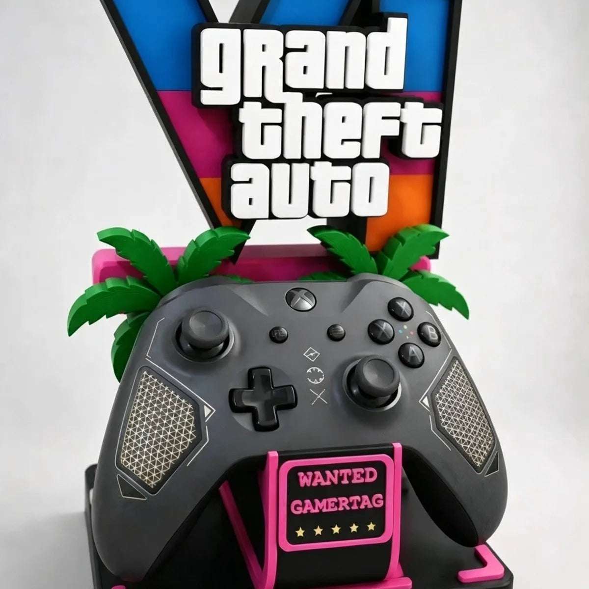 Gaming controller holder ornament close-up with gray controller, palm details, pink “Wanted” panel