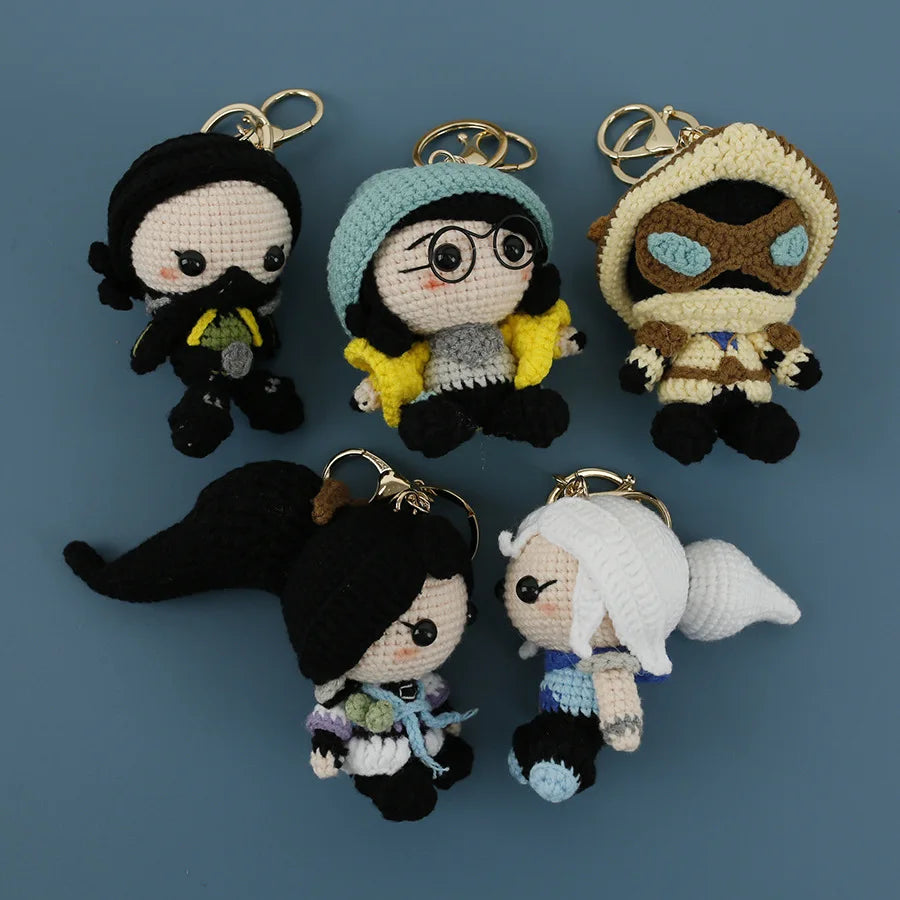 Set of five crocheted agent plush keychains, each with a metal key ring and face