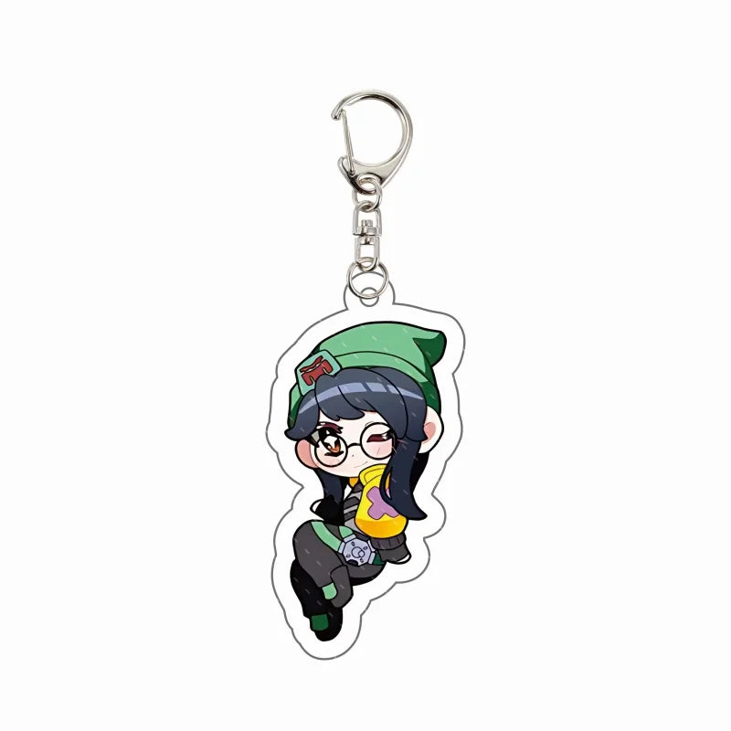 Chibi agent acrylic keychain charm with teal cap, glasses, and black-and-green outfit