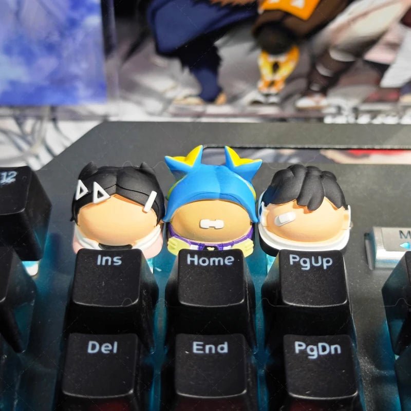 Gaming keyboard keycaps with blue spiky custom center and black keys marked Home, Del, Ins