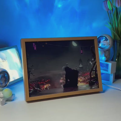 Framed LED lighting canvas with dark illustrated scene and soft blue glow