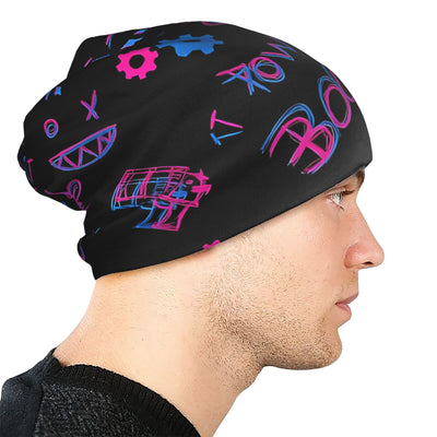 Black slouch beanie with colorful graffiti print, worn on a model in profile