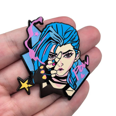 Blue-haired character enamel pin held in hand