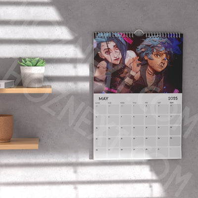 2026 wall calendar with colorful character artwork and May layout on the front