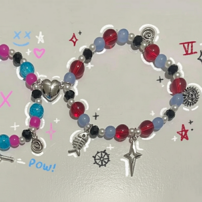 Matching beaded bracelets with red, blue, black, and pink beads; heart, wing, and gun charms.