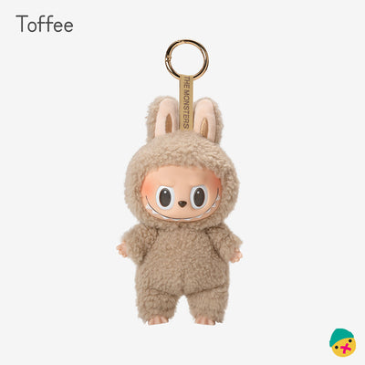 Toffee plush-style monster vinyl keychain toy, tan hooded outfit with big eyes