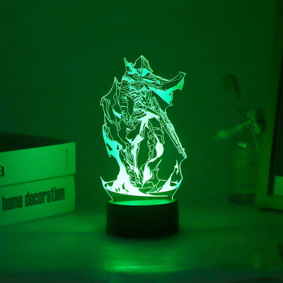 Acrylic LED lamp with character graphic lit in green on a black round base.