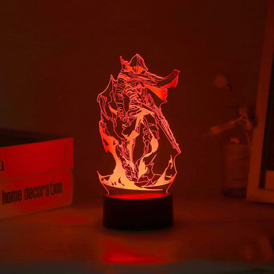 Acrylic LED lamp with character graphic lit in red on a black round base.