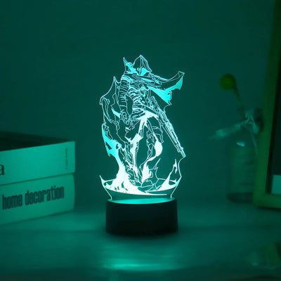 Acrylic LED lamp with character graphic lit in teal on a black round base.