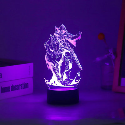 Acrylic LED lamp with character graphic lit in purple on a black round base.