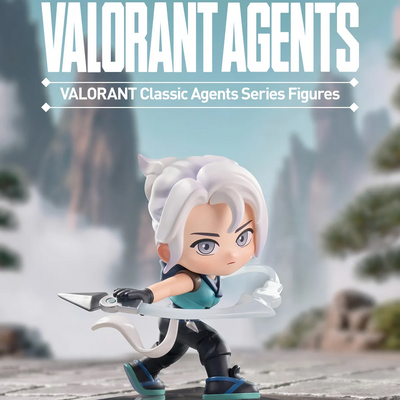 A Pop Mart Valorant Classic Agents Series Figures collectible toy of Phoenix, shown in a stylized 3D render on a stone surface with a blurred mountain background. The figure has white hair, a teal top, black pants, and holds a silver blade.
