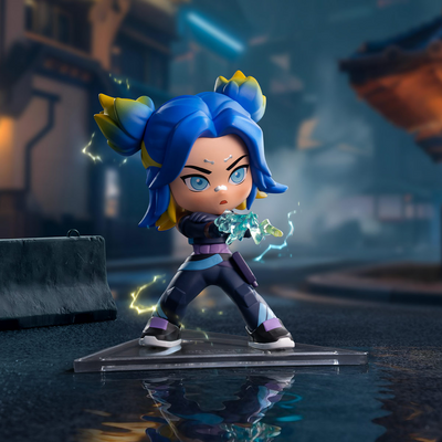 Neon A chibi-style collectible figurine of a blue-haired character with yellow hair accents, posed mid-action on a clear acrylic base in a blurred dark urban environment.
