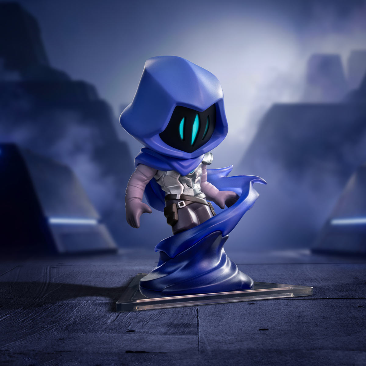 Omen A stylized blue hooded fantasy character figurine or collectible stand, posed on a dark platform in a misty blue scene. The figure has glowing cyan eyes, pale skin, and a flowing blue cape-like base, with no visible brand text.