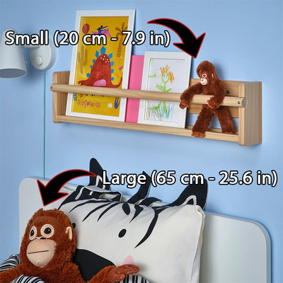 Two brown plush monkey toys shown on shelf and beside a bed pillow.