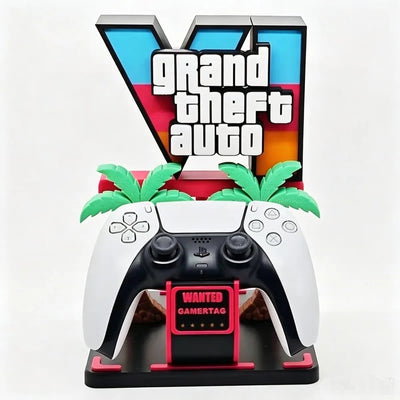 Gaming controller holder ornament with black controller on dark base, green palm details, “Wanted” card