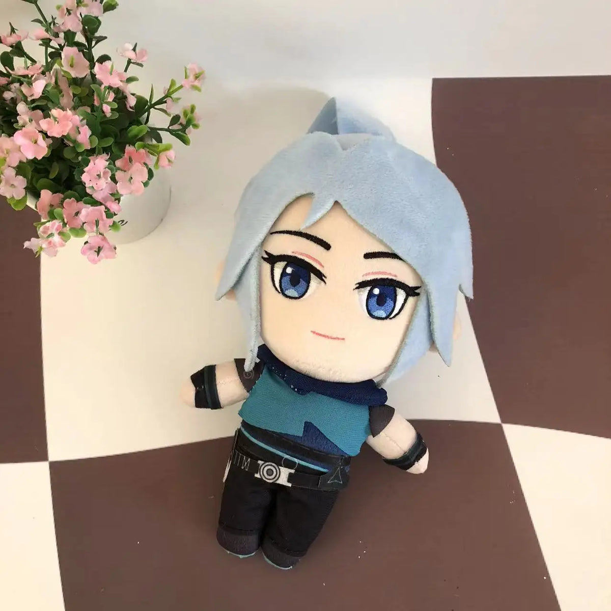 Light blue anime-style plush doll with teal scarf and black pants, full body