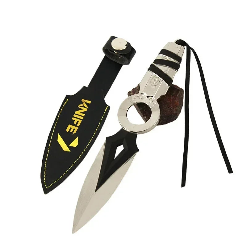 Kunai knife keychain with black sheath strap, silver ring, and white double-blade blade