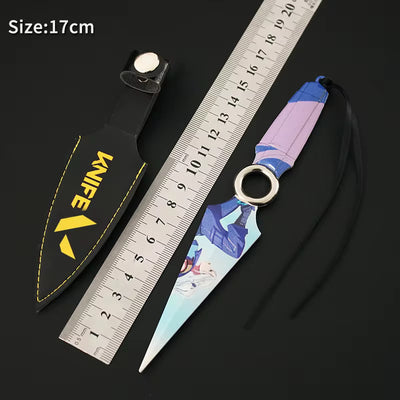 Kunai knife prop with black sheath, yellow logo text, and purple-blue patterned grip; 17cm label