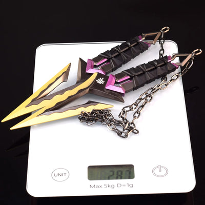Kuronami VALORANT knife keychain on white card, black with purple accents and gold tips