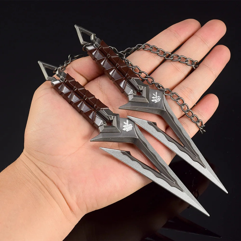 Kuronami VALORANT knife keychain in hand, silver and dark red double-blade design