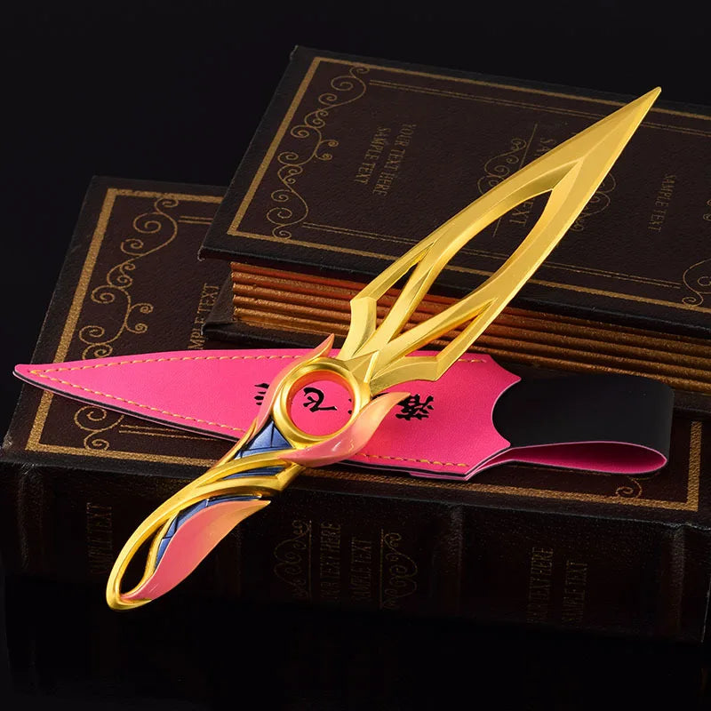 Kunai knife with pink sheath and gold blade, large round ring detail and gold edge