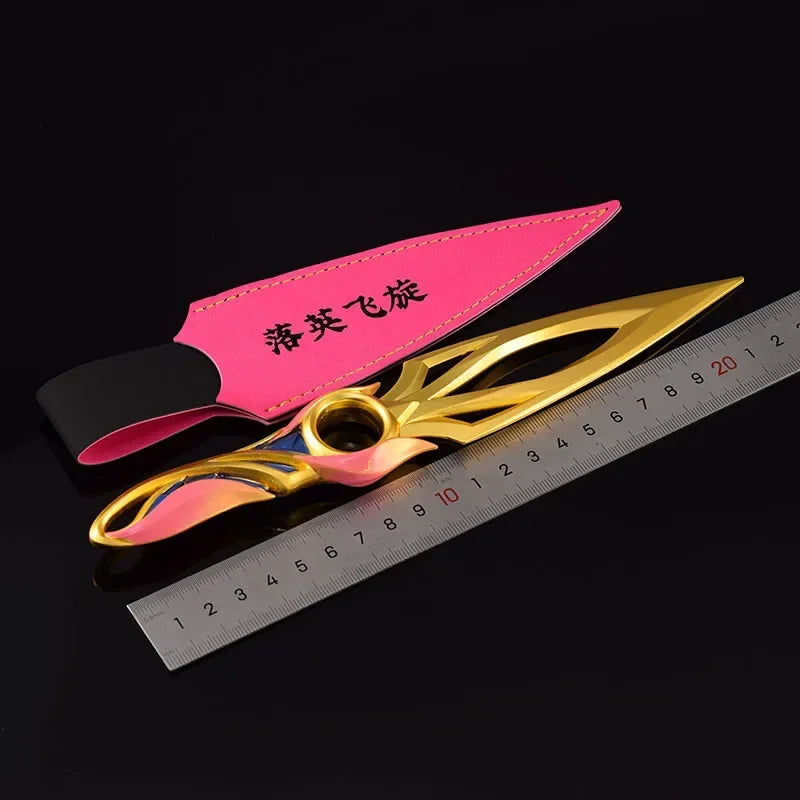 Kunai knife with pink sheath and gold blade, blue-pink accents and round finger ring