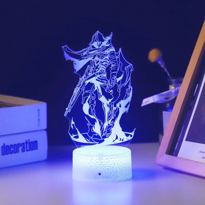 Acrylic LED light with gaming character silhouette, glowing blue on textured base