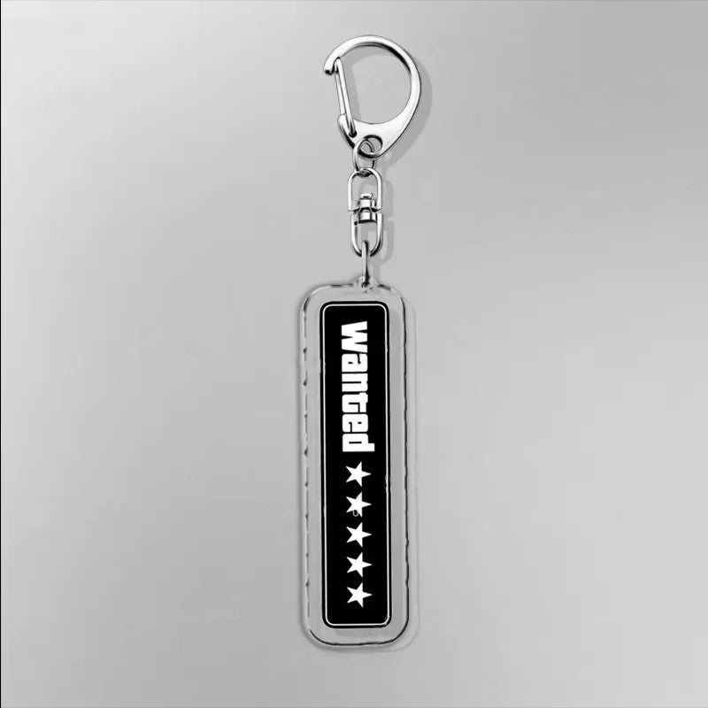 Acrylic keychain with “WASTED” vertical lettering on a black background