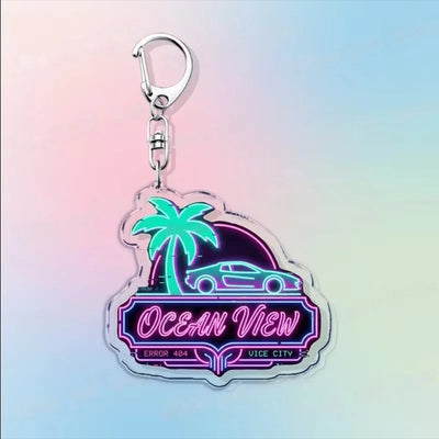 Silver hook acrylic keychain with a palm tree and neon “Ocean View” sign design.