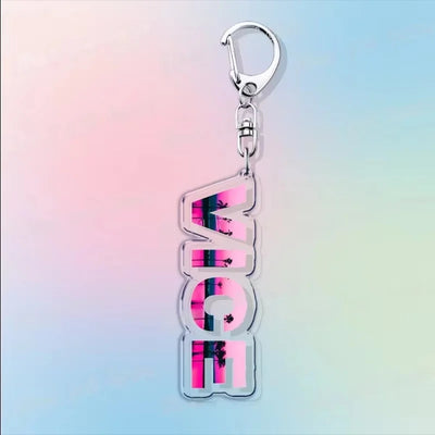 Silver hook acrylic keychain with stacked “VI” lettering in pink, purple, and black.