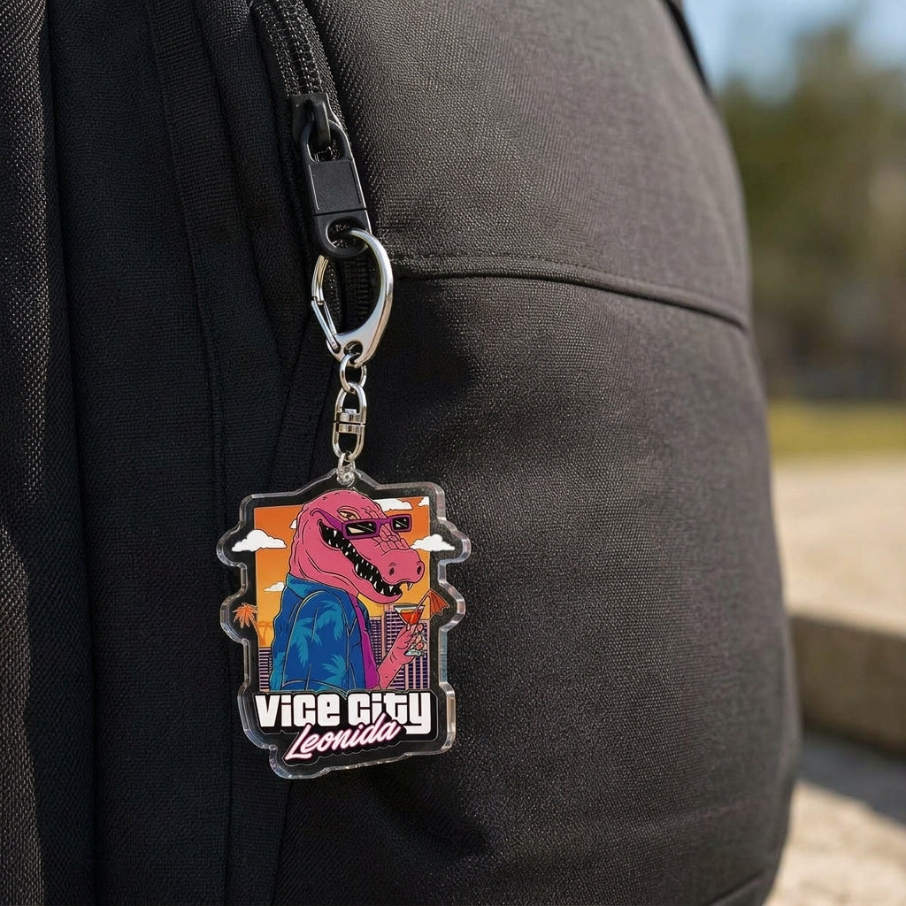 Acrylic keychain on a black backpack strap with “Vice City Leonida” logo.