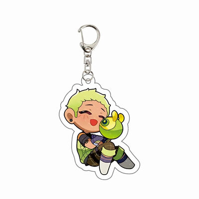 Chibi agent acrylic keychain charm with blonde hair, green highlights, and holding green gadget