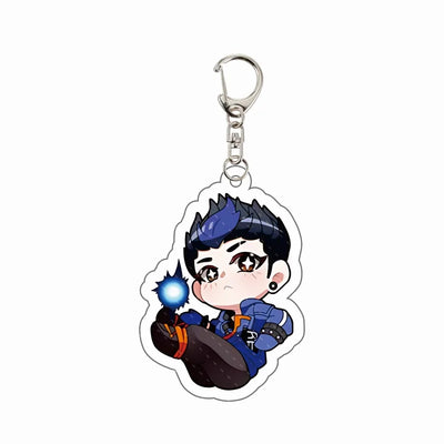 Chibi agent acrylic keychain charm with blue hair, holding glowing orb and orange gloves