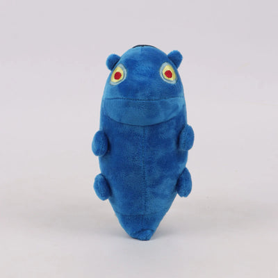 Blue plush toy standing upright with small arms and red-and-yellow eye emblems.