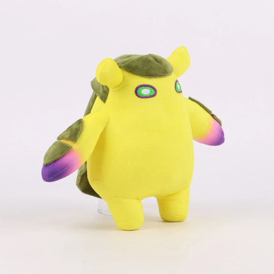Yellow plush toy with olive head and gradient purple wings, rear/side view.