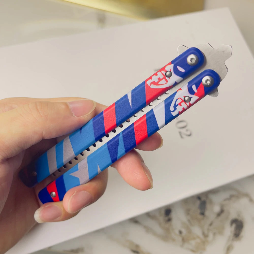 Blue and red striped butterfly-style knife with comb teeth and metal handles