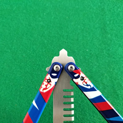 Close-up of blue and red patterned comb handles with metal hinge hardware