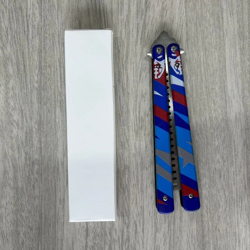 Blue and red butterfly knife comb with grey serrated blade, upright view