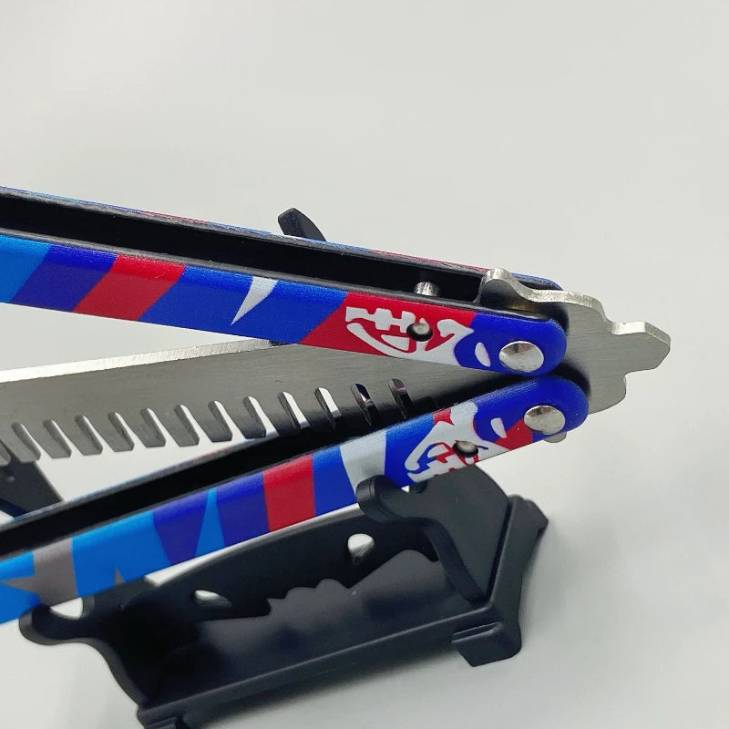 Close-up of blue-red butterfly knife comb with grey serrated edge